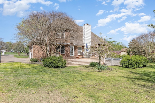 1622 Hickory Valley Rd, Lebanon, TN 37087 - back of house with a lawn, brick siding, and a chimney