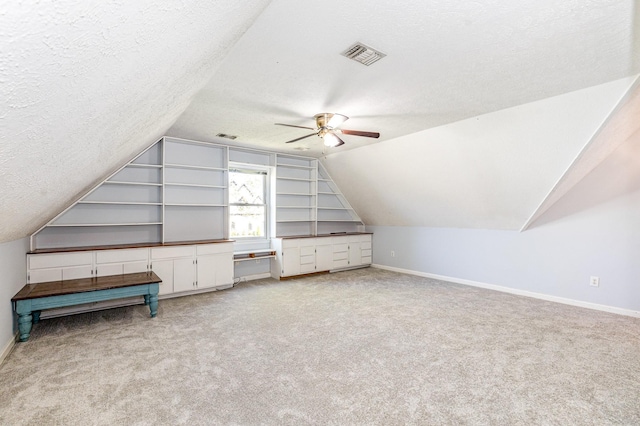 1622 Hickory Valley Rd, Lebanon, TN 37087 - bonus room featuring a textured ceiling, ceiling fan, lofted ceiling, carpet floors, and built in features
