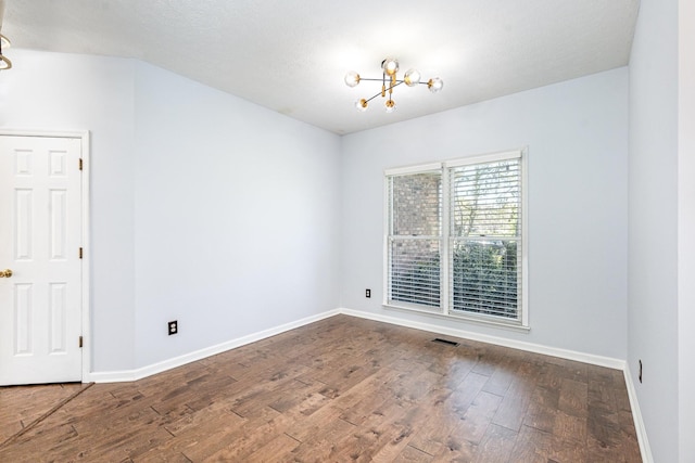 1622 Hickory Valley Rd, Lebanon, TN 37087 - spare room featuring a chandelier and wood finished floors