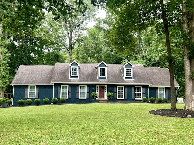 187 Hidden Lake Rd, Hendersonville, TN 37075 - cape cod home with a front lawn, view of scattered trees, and roof with shingles