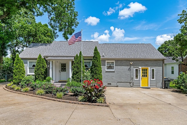 1519 Preston Dr, Nashville, TN 37206 - view of front of house with brick siding, roof with shingles, and concrete driveway