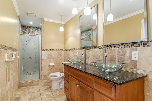 1519 Preston Dr, Nashville, TN 37206 - bathroom featuring tile walls, a stall shower, ornamental molding, double vanity, and tile patterned floors