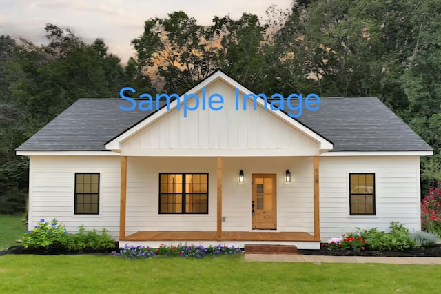 0 Turkey Creek Rd, Tullahoma, TN 37388 - modern farmhouse featuring covered porch, board and batten siding, a front yard, and roof with shingles