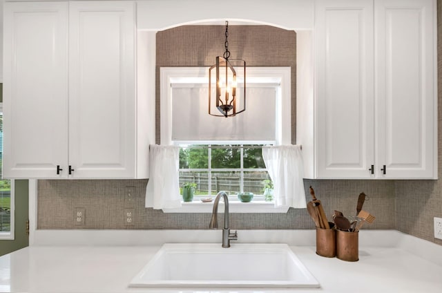 1511 Bridle Ln, Chapel Hill, TN 37034 - kitchen featuring white cabinetry, light countertops, tasteful backsplash, and pendant lighting