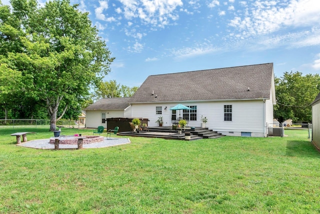1511 Bridle Ln, Chapel Hill, TN 37034 - back of property featuring a fenced backyard, a covered hot tub, a fire pit, a shingled roof, and a deck