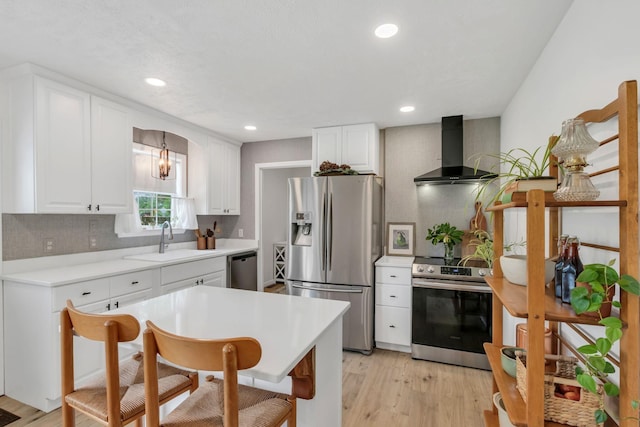 1511 Bridle Ln, Chapel Hill, TN 37034 - kitchen with stainless steel appliances, wall chimney exhaust hood, light wood finished floors, decorative backsplash, and white cabinetry