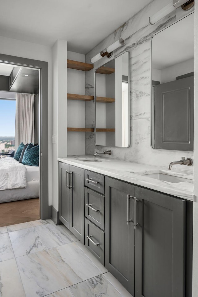 1616 W End Ave Unit 2609, Nashville, TN 37203 - full bath with double vanity, marble look tile flooring, and ensuite bath