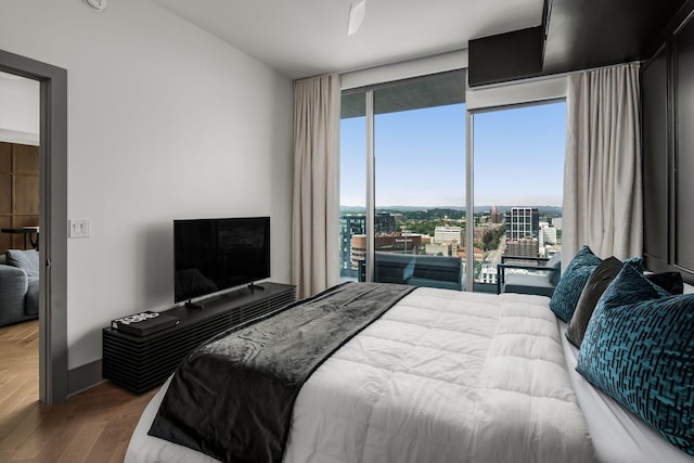 1616 W End Ave Unit 2609, Nashville, TN 37203 - bedroom with wood finished floors, floor to ceiling windows, and access to outside