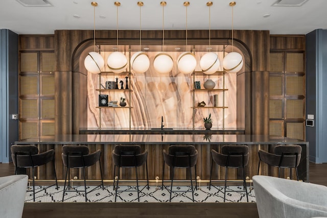 1616 W End Ave Unit 2609, Nashville, TN 37203 - indoor bar featuring dark wood-style flooring and pendant lighting