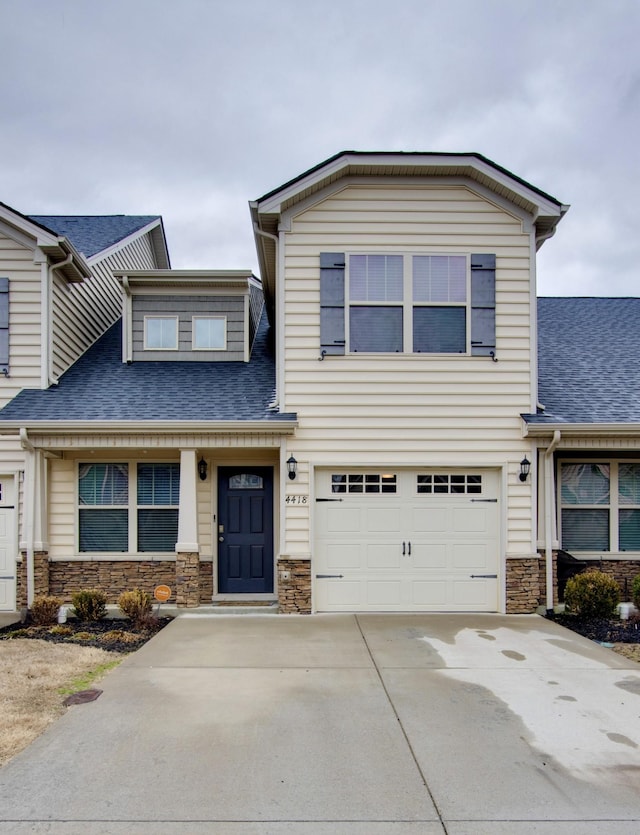 4418 Prometheus Way, Murfreesboro, TN 37128 - view of front of home with stone siding, roof with shingles, driveway, and an attached garage