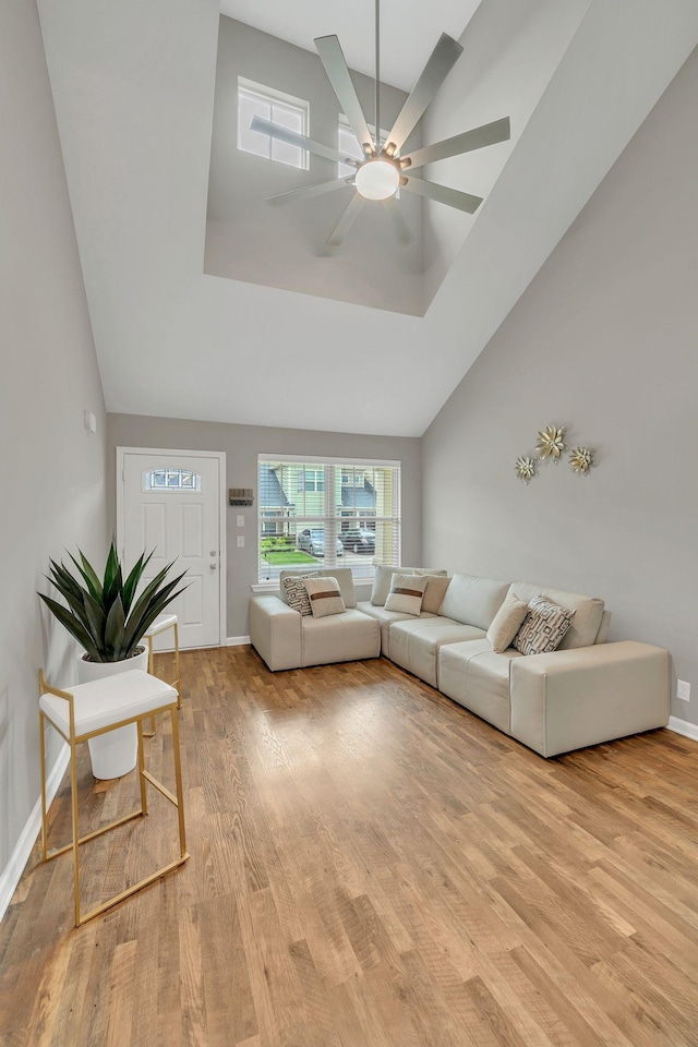 4418 Prometheus Way, Murfreesboro, TN 37128 - living area featuring light wood finished floors, a ceiling fan, and high vaulted ceiling