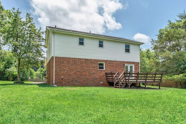 545 Old Lebanon Dirt Rd, Hermitage, TN 37076 - rear view of property featuring a deck, a lawn, and brick siding