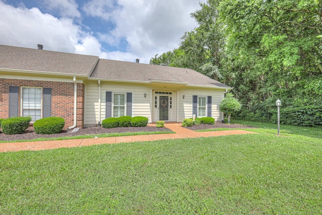 943 E Northfield Blvd, Murfreesboro, TN 37130 - view of front of home with a front lawn, roof with shingles, and brick siding
