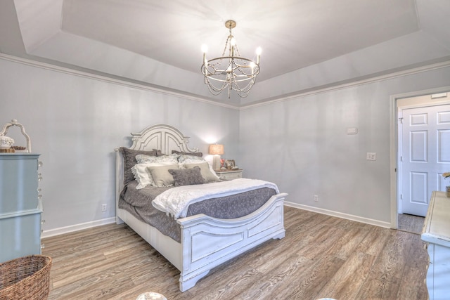 943 E Northfield Blvd, Murfreesboro, TN 37130 - bedroom with a raised ceiling, a chandelier, wood finished floors, and crown molding