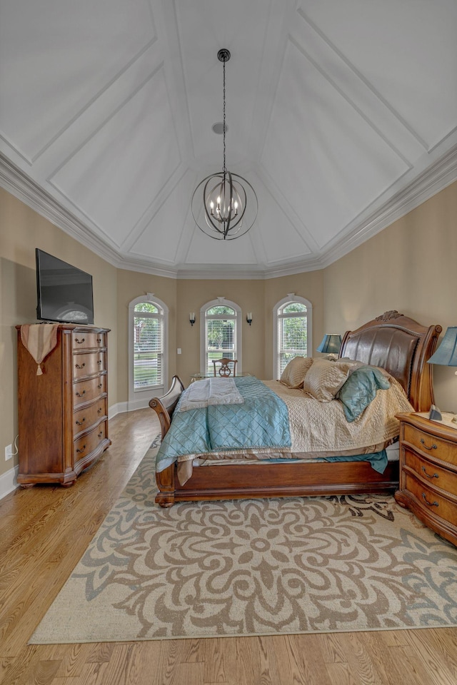 2711 Crowne Pointe Dr, Murfreesboro, TN 37130 - bedroom with multiple windows, a chandelier, wood finished floors, vaulted ceiling, and ornamental molding