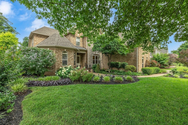 2711 Crowne Pointe Dr, Murfreesboro, TN 37130 - view of front of property featuring a front lawn, brick siding, and roof with shingles