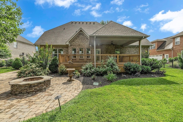 2711 Crowne Pointe Dr, Murfreesboro, TN 37130 - back of house featuring a fire pit, ceiling fan, brick siding, a wooden deck, and a patio