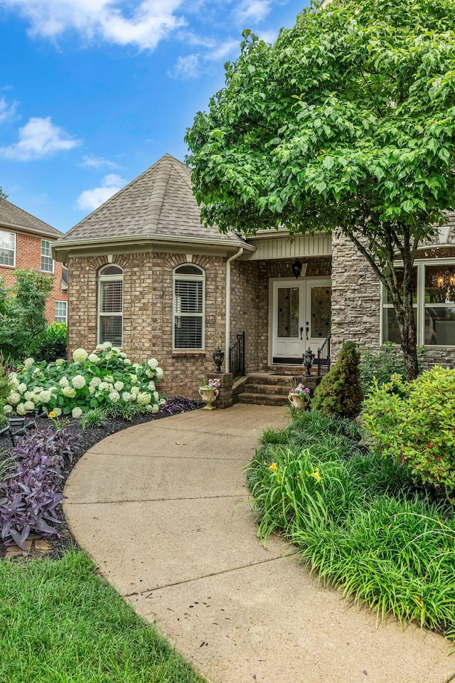 2711 Crowne Pointe Dr, Murfreesboro, TN 37130 - view of front of home with roof with shingles, brick siding, and french doors