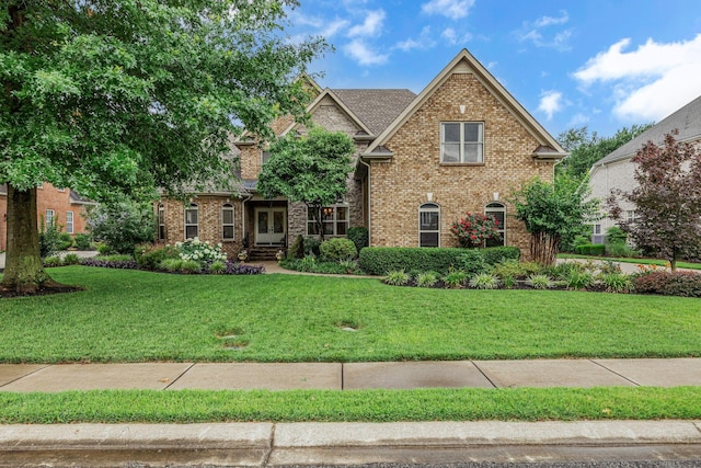 2711 Crowne Pointe Dr, Murfreesboro, TN 37130 - view of front of house with french doors, brick siding, and a front lawn