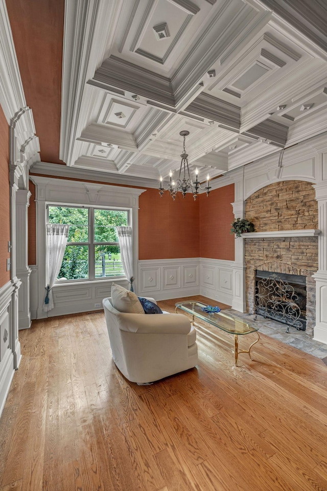 2711 Crowne Pointe Dr, Murfreesboro, TN 37130 - living room featuring a fireplace, a decorative wall, a chandelier, ornamental molding, and coffered ceiling