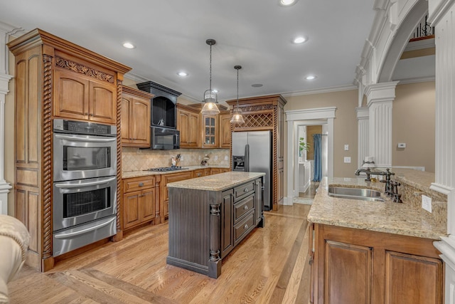 2711 Crowne Pointe Dr, Murfreesboro, TN 37130 - kitchen with a warming drawer, stainless steel appliances, decorative columns, a center island, and crown molding