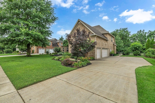 2711 Crowne Pointe Dr, Murfreesboro, TN 37130 - view of front of home featuring driveway, brick siding, a garage, and a front lawn
