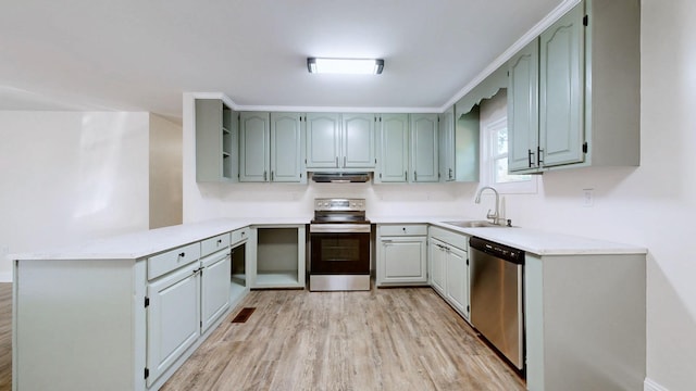 152 Mink Branch Rd E, Waynesboro, TN 38485 - kitchen with appliances with stainless steel finishes, under cabinet range hood, a peninsula, light wood-type flooring, and light countertops