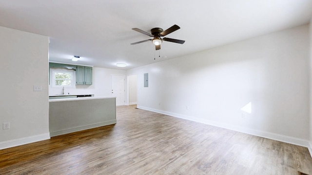 152 Mink Branch Rd E, Waynesboro, TN 38485 - unfurnished living room with ceiling fan, wood finished floors, and electric panel