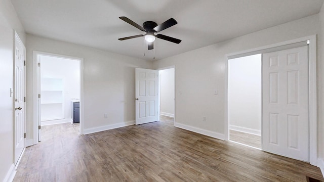 152 Mink Branch Rd E, Waynesboro, TN 38485 - unfurnished bedroom featuring wood finished floors, ensuite bath, and a ceiling fan