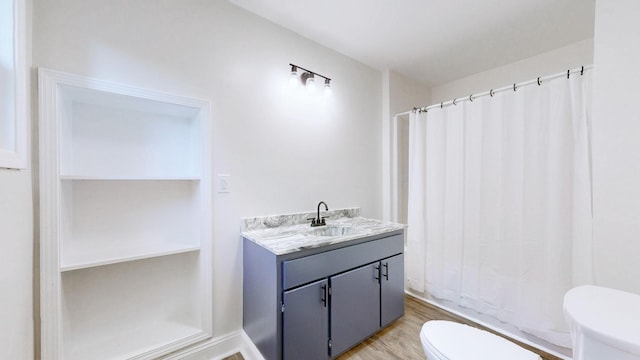 152 Mink Branch Rd E, Waynesboro, TN 38485 - full bath featuring wood finished floors, vanity, and curtained shower