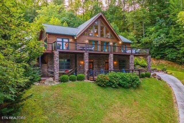 645 Bankston Ln, La Follette, TN 37766 - back of house featuring a yard and a forest view