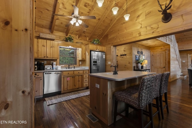 645 Bankston Ln, La Follette, TN 37766 - kitchen featuring appliances with stainless steel finishes, wood walls, dark wood finished floors, wooden ceiling, and light countertops