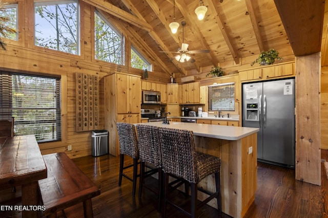 645 Bankston Ln, La Follette, TN 37766 - kitchen with appliances with stainless steel finishes, dark wood-type flooring, high vaulted ceiling, wood walls, and a wood ceiling with exposed beams