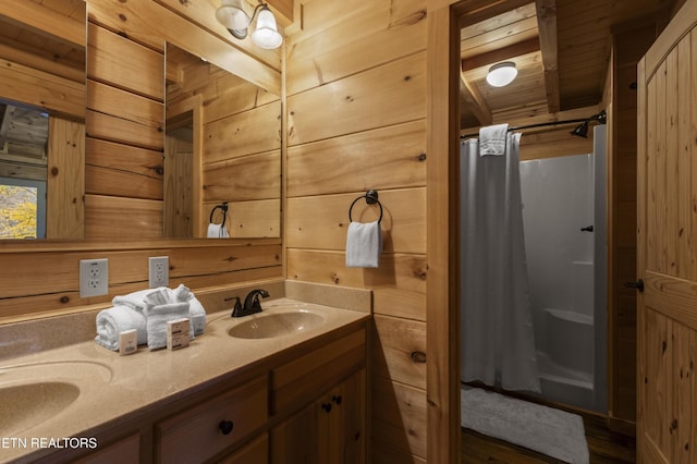 645 Bankston Ln, La Follette, TN 37766 - bathroom featuring double vanity, curtained shower, wooden walls, and wood finished floors