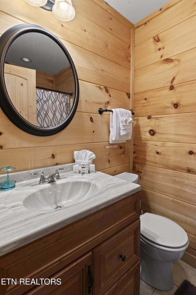 645 Bankston Ln, La Follette, TN 37766 - bathroom featuring vanity and wooden walls