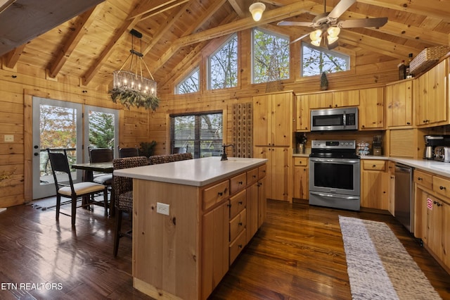 645 Bankston Ln, La Follette, TN 37766 - kitchen featuring stainless steel appliances, healthy amount of natural light, light brown cabinetry, dark wood-type flooring, and high vaulted ceiling