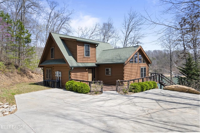 645 Bankston Ln, La Follette, TN 37766 - view of front facade featuring a shingled roof and covered porch