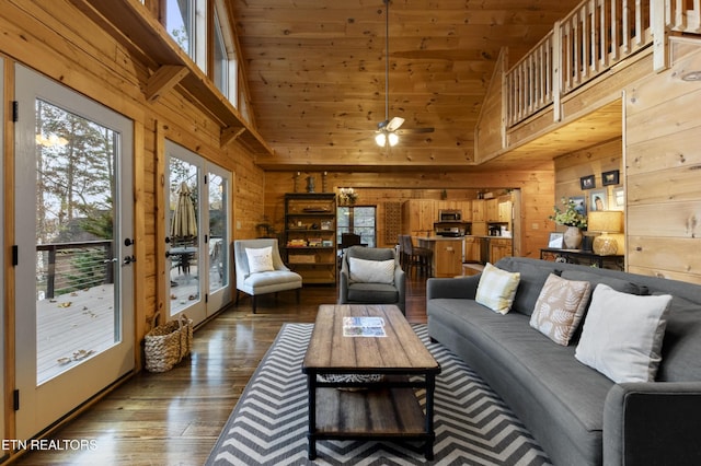 645 Bankston Ln, La Follette, TN 37766 - living room with wooden walls, wood finished floors, high vaulted ceiling, ceiling fan, and french doors