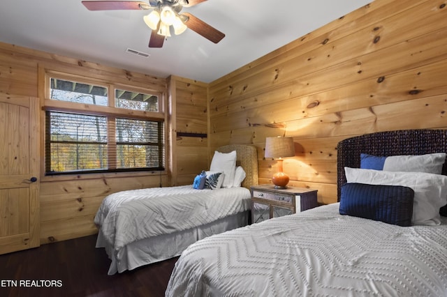 645 Bankston Ln, La Follette, TN 37766 - bedroom featuring wood walls, wood finished floors, and a ceiling fan