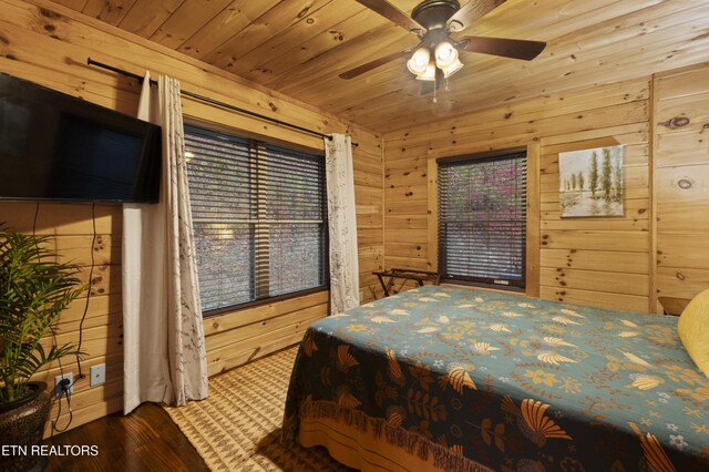 645 Bankston Ln, La Follette, TN 37766 - bedroom with wood walls, wooden ceiling, wood finished floors, and a ceiling fan