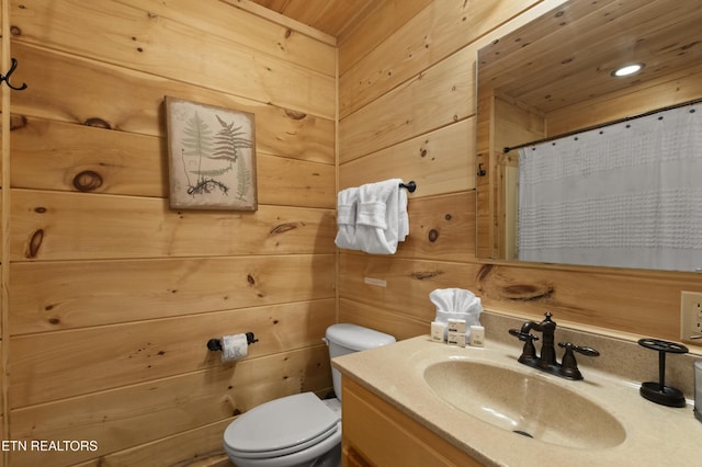 645 Bankston Ln, La Follette, TN 37766 - bathroom featuring vanity, a shower with shower curtain, and wooden walls