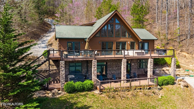 645 Bankston Ln, La Follette, TN 37766 - back of property featuring a wooden deck, stairway, and stone siding