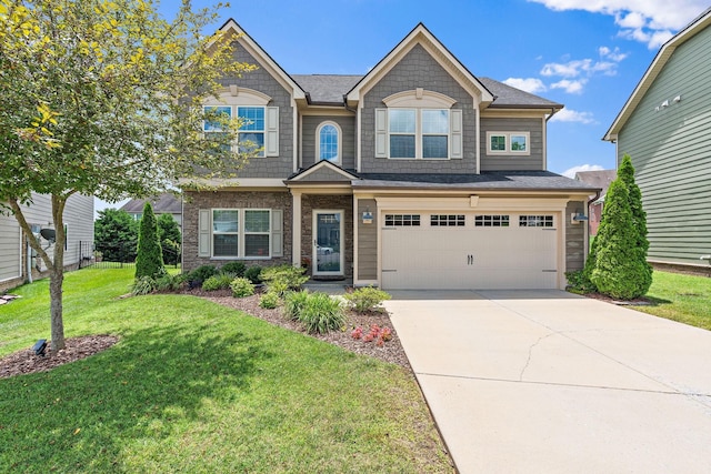 444 Heroit Dr, Spring Hill, TN 37174 - craftsman house featuring a garage, a front lawn, and driveway