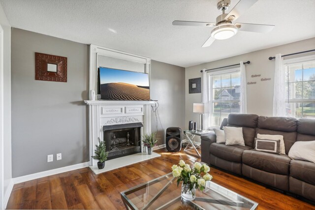 1287 Cheryl Ct, Clarksville, TN 37042 - living area with a high end fireplace, wood finished floors, ceiling fan, and a textured ceiling