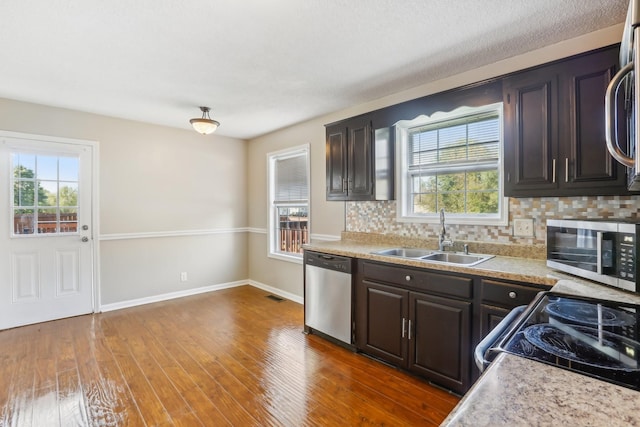 1287 Cheryl Ct, Clarksville, TN 37042 - kitchen featuring appliances with stainless steel finishes, decorative backsplash, and light countertops