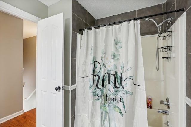 1287 Cheryl Ct, Clarksville, TN 37042 - full bathroom featuring shower / bath combo with shower curtain and wood finished floors