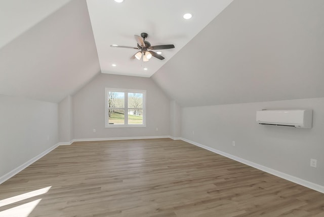 991 Scenic Dr, Pulaski, TN 38478 - additional living space featuring a wall mounted air conditioner, ceiling fan, vaulted ceiling, light wood finished floors, and recessed lighting