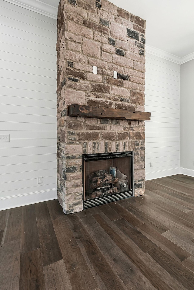 991 Scenic Dr, Pulaski, TN 38478 - detailed view of a fireplace, wood finished floors, ornamental molding, and wooden walls