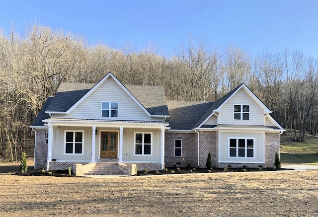 991 Scenic Dr, Pulaski, TN 38478 - view of front of home with a porch, board and batten siding, brick siding, and french doors