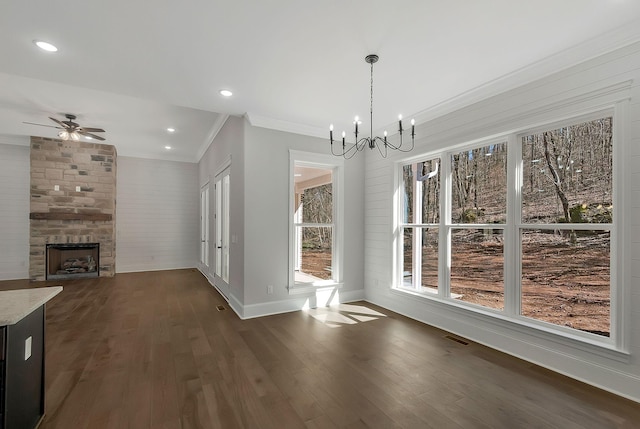 991 Scenic Dr, Pulaski, TN 38478 - unfurnished dining area featuring ornamental molding, a chandelier, dark wood-style flooring, a fireplace, and a ceiling fan